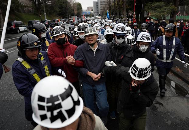 Protesters take part in an anti-U.S., anti-war and anti-Prime Minister Sanae Takaichi rally, in Tokyo