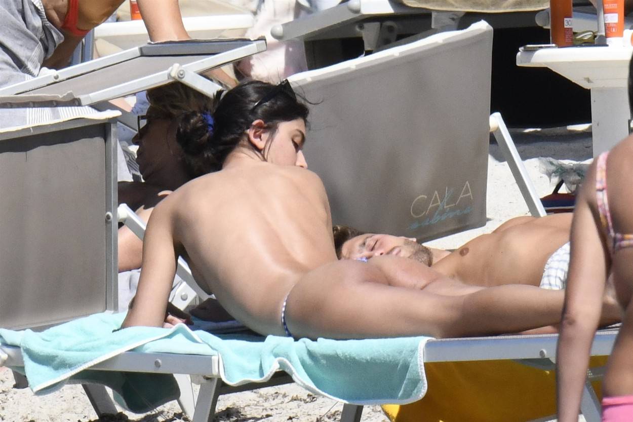 *EXCLUSIVE* Spanish actress Lucia Rivera Romero is seen topless with her boyfriend Nacho Méndez on the beach in Sardinia.