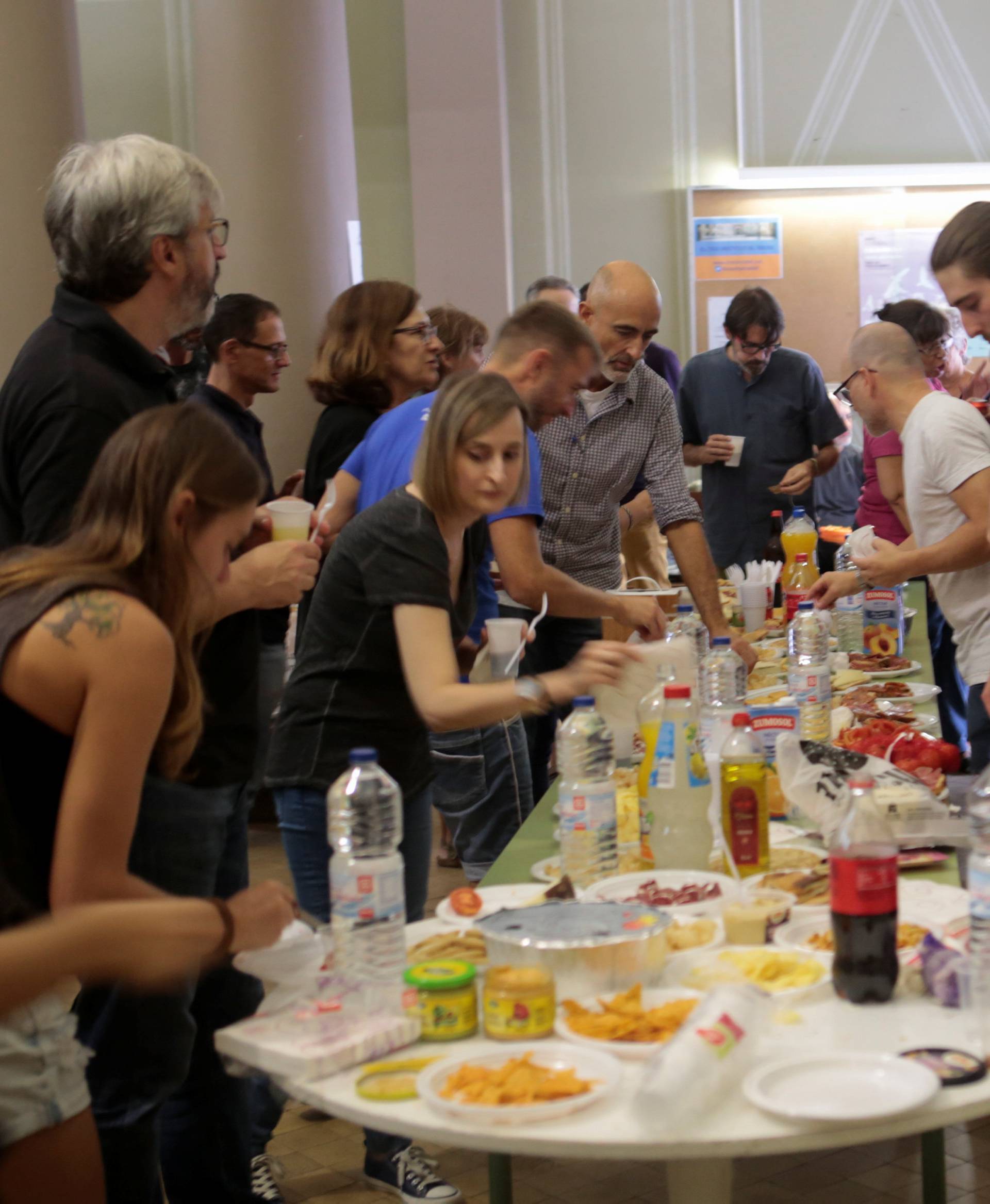 People have lunch inside the occupied Miquel Tarradell High School, one of the designated polling stations, the day before the banned independence referendum in Barcelona
