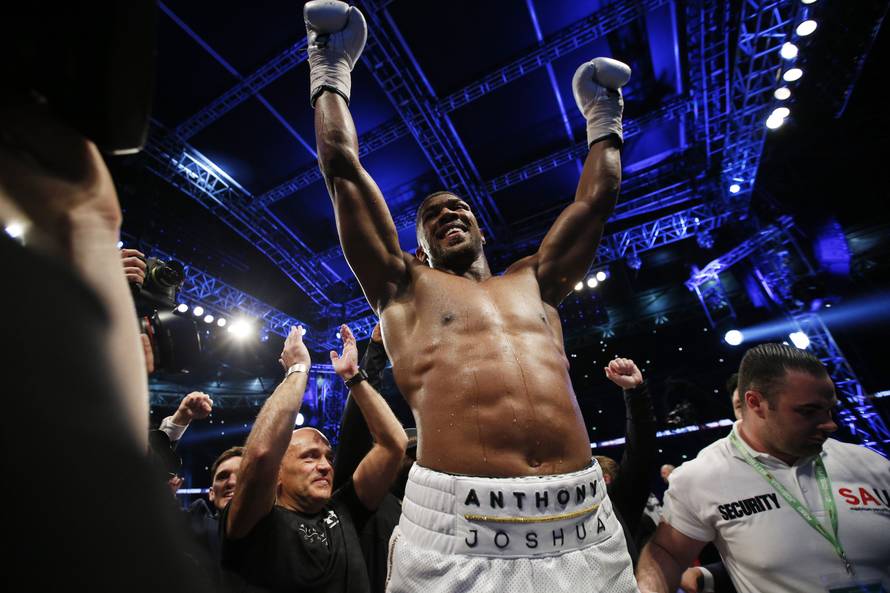 Anthony Joshua celebrates after winning the fight