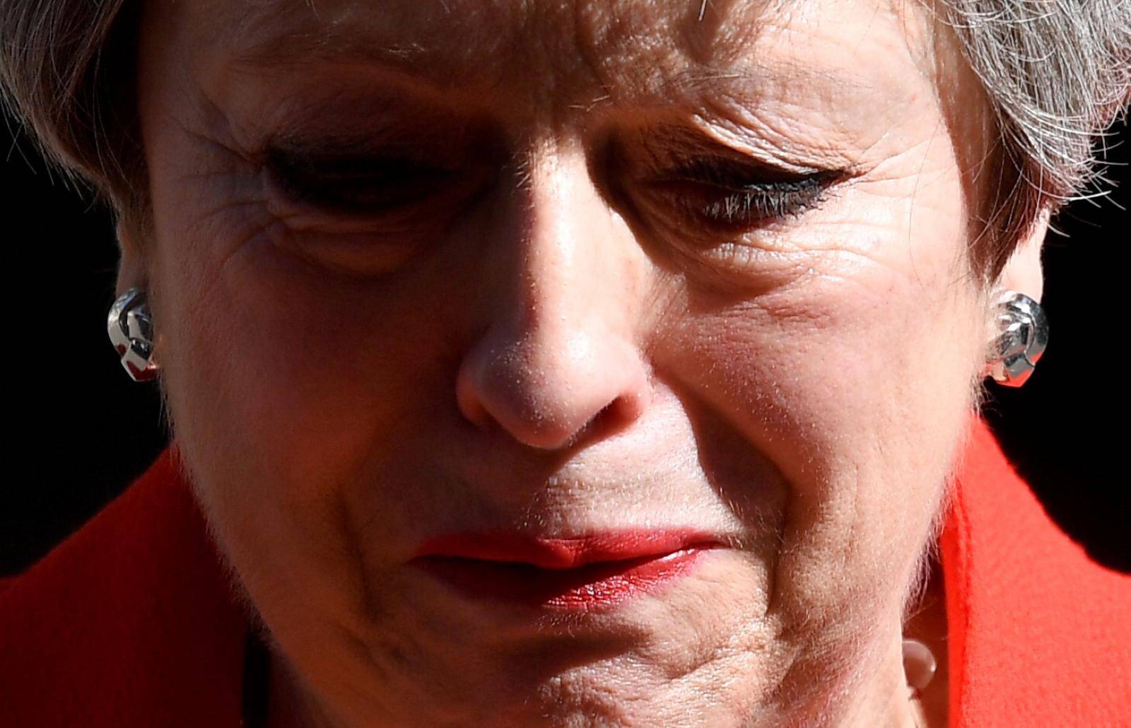 British Prime Minister Theresa May reacts as she delivers a statement in London