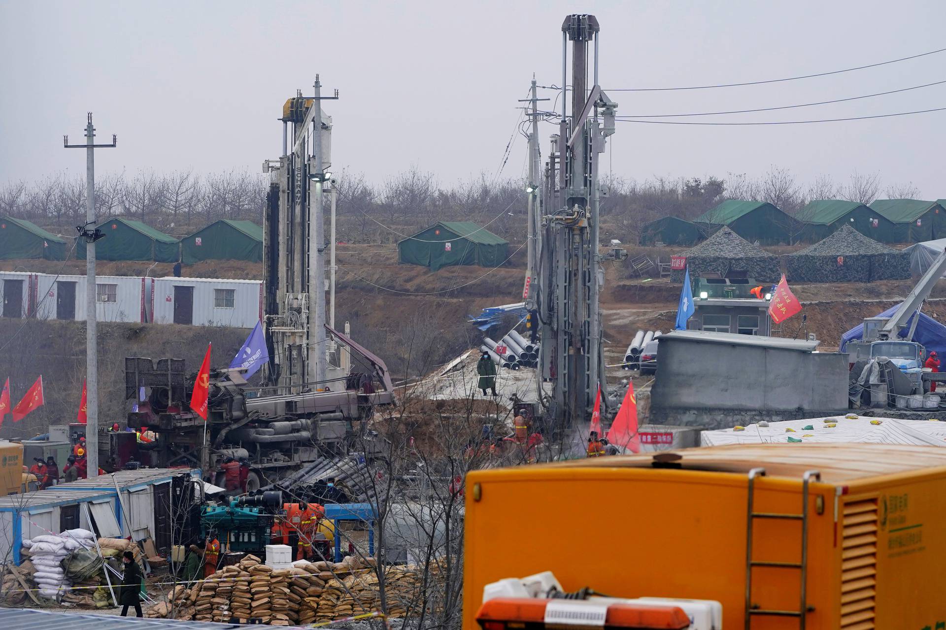 Rescuers work at the Hushan gold mine where workers were trapped underground after the Jauary 10 explosion, in Qixia