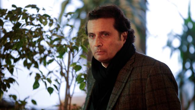 FILE PHOTO: Captain of the Costa Concordia cruise liner Francesco Schettino looks on during a break of his trial in Grosseto