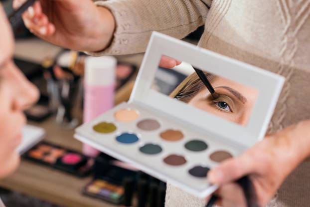 Make up artist applying eyeshadows