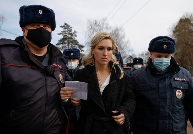 Russian police officers detain Anastasiya Vasilyeva, a doctor and ally of Kremlin critic Alexei Navalny, near the IK-2 corrective penal colony in Pokrov