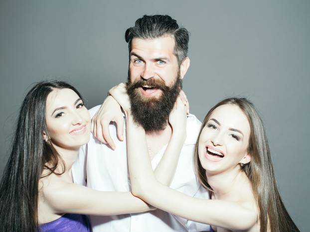 Bearded man and two women