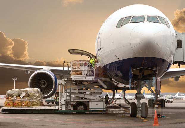 Loading,Cargo,On,The,Plane,In,Airport,,View,Through,Window