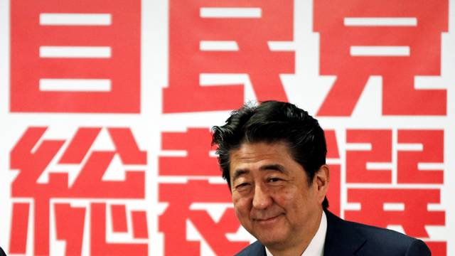 Japan's Prime Minister and ruling LDP leader Shinzo Abe attends a joint news conference for the party leader election at their headquarters in Tokyo