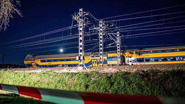 A general view shows aftermath following the derailment of a passenger train after it hit construction equipment on the track, in Voorschoten