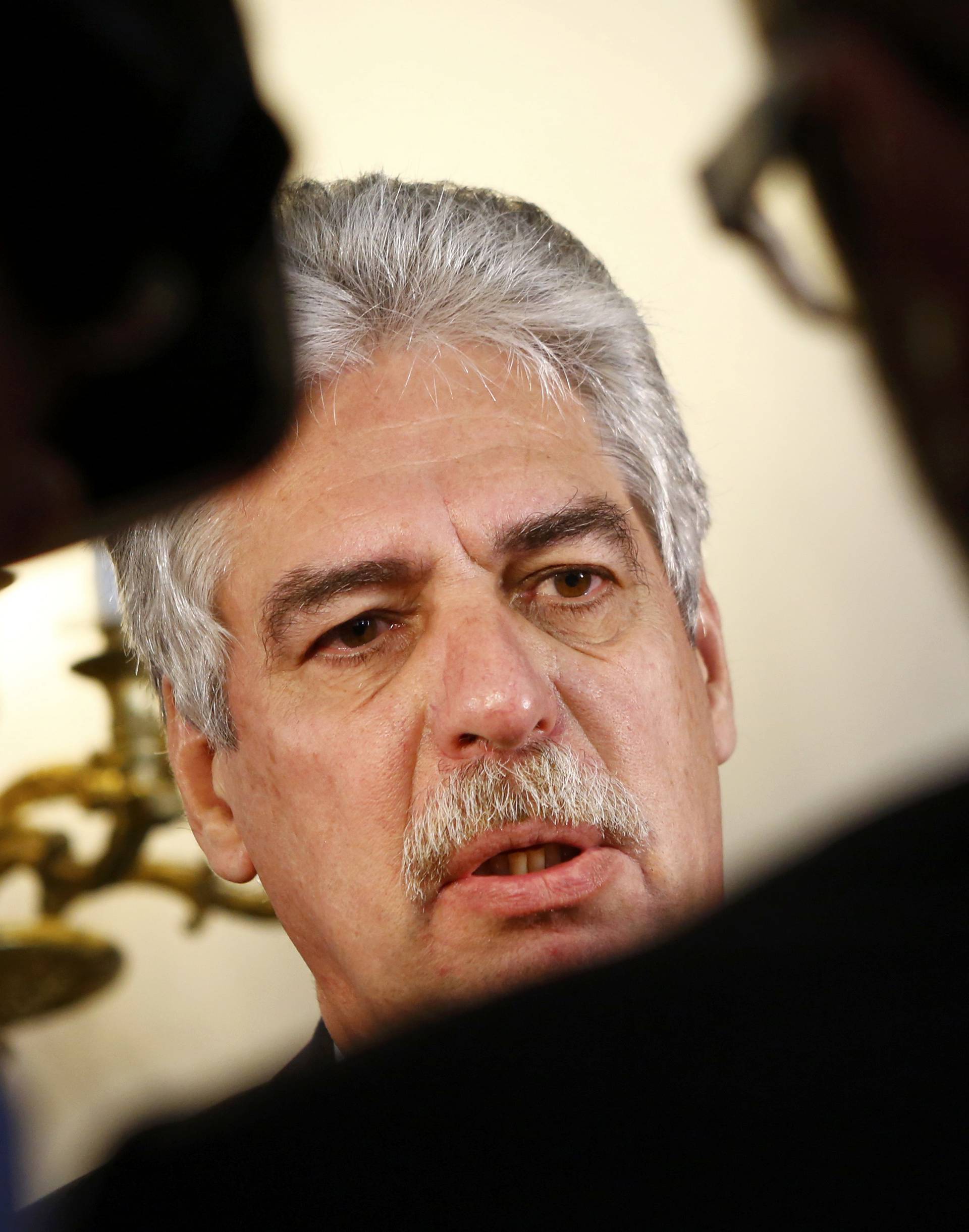 Austrian Finance Minister Schelling talks to the media as he arrives for a cabinet meeting in Vienna