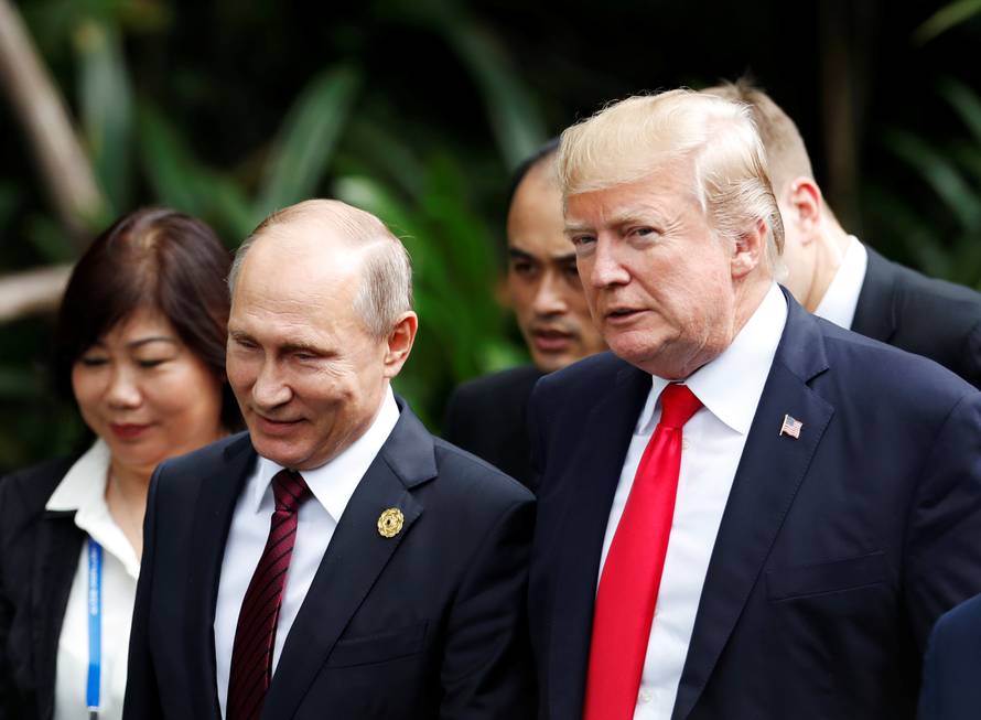 U.S. President Donald Trump and Russia's President Vladimir Putin attend the family photo session at the APEC Summit in Danang, Vietnam