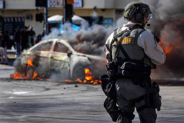 Standoff by protesters and law enforcement, following multiple detentions by ICE in Los Angeles County