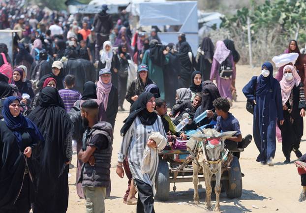 Palestinians seek aid from the U.S.-backed Gaza Humanitarian Foundation, near Rafah