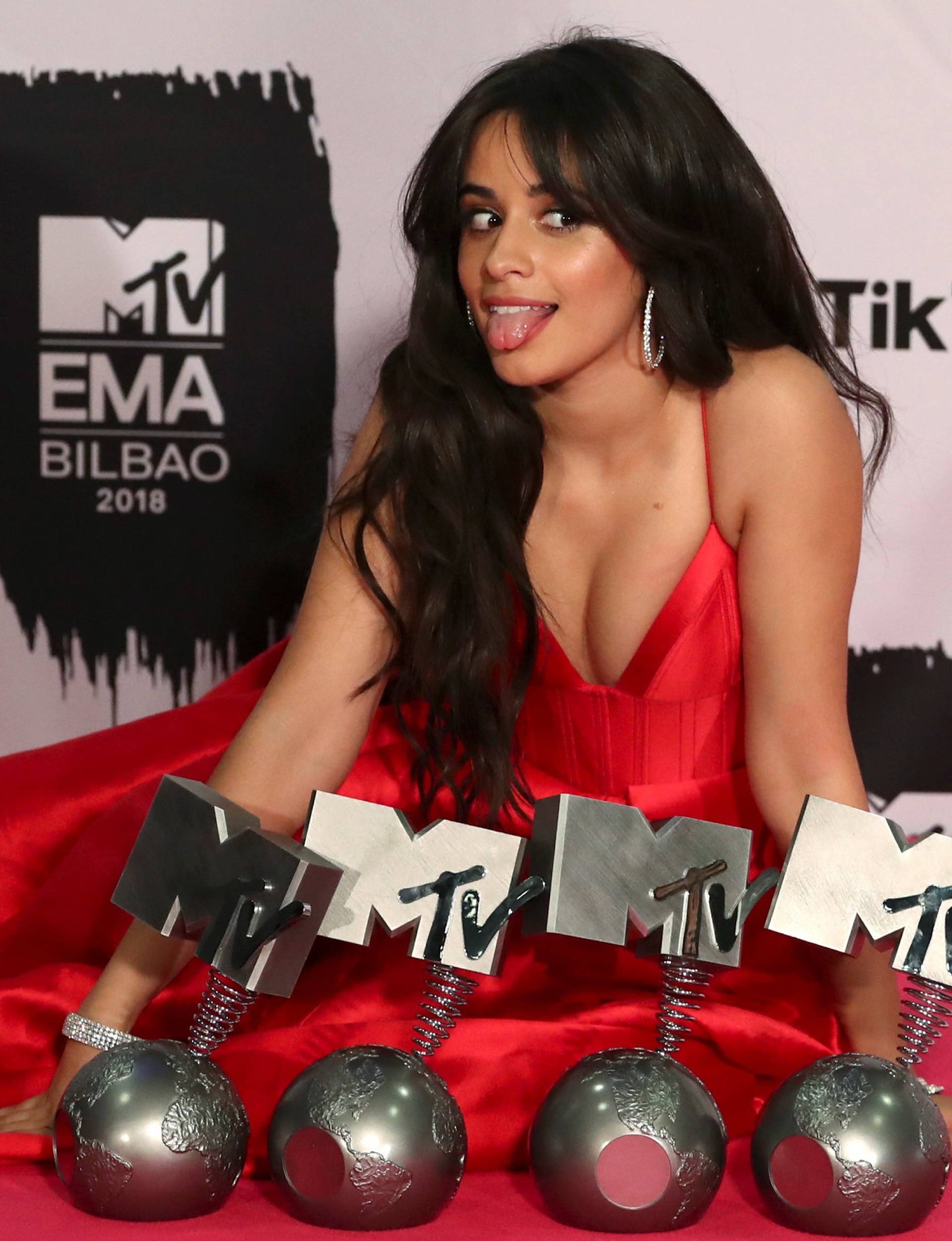 Camila Cabello poses with her awards during the 2018 MTV Europe Music Awards at Bilbao Exhibition Centre in Bilbao