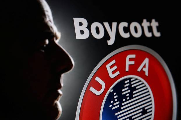 Illustration shows silhouette of Gianni Infantino, FIFA President, UEFA logo and word "Boycott\