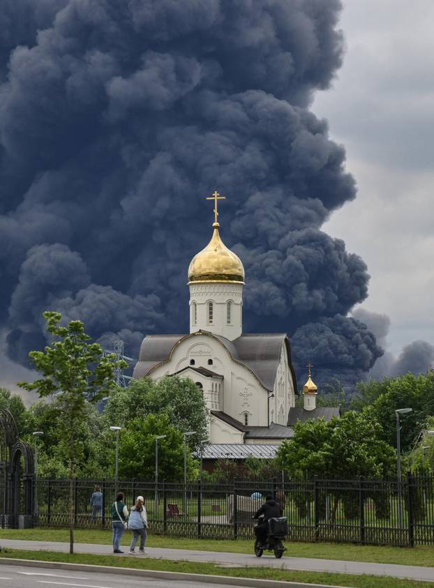 Smoke rises from an oil refinery following a Ukrainian drone attack in Moscow