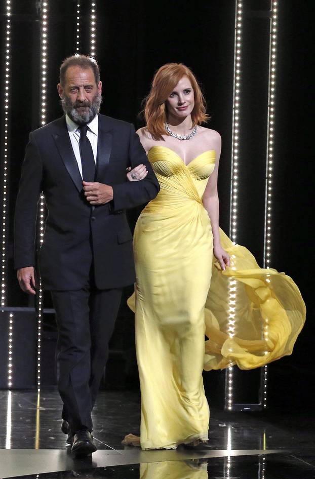 Actor Vincent Lindon and actress Jessica Chastain arrive on stage during the opening ceremony of the 69th Cannes Film Festival in Cannes