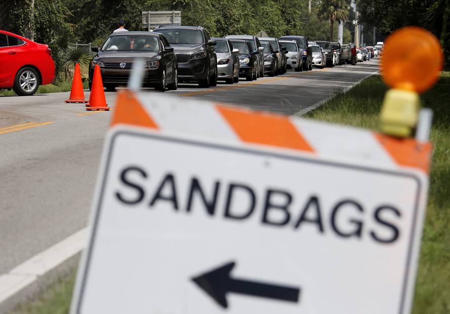 Motorists form long queue to get sandbags at Kissimmee, in preparation for the arrival of Hurricane Irma making landfall, in Florida