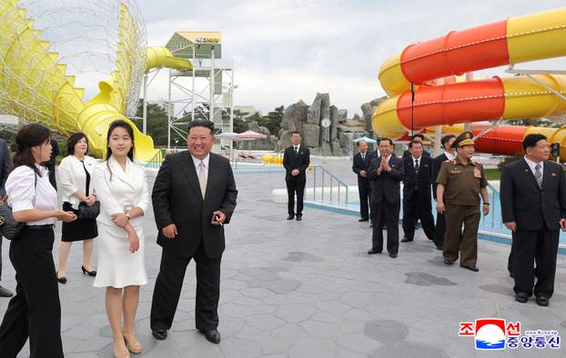 North Korean leader Kim Jong Un and his daughter Kim Ju Ae attend a ceremony to celebrate the completion of the Wonsan Kalma Coastal Tourist Zone