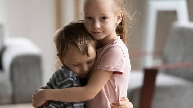 Head,Shot,Portrait,Of,Little,Kid,Girl,Cuddling,Smaller,Brother