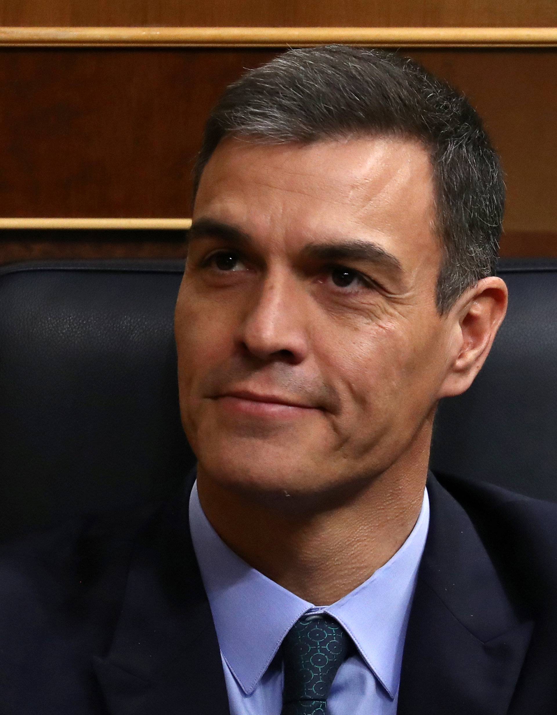 Spain's Prime Minister Pedro Sanchez reacts during a session at Parliament in Madrid