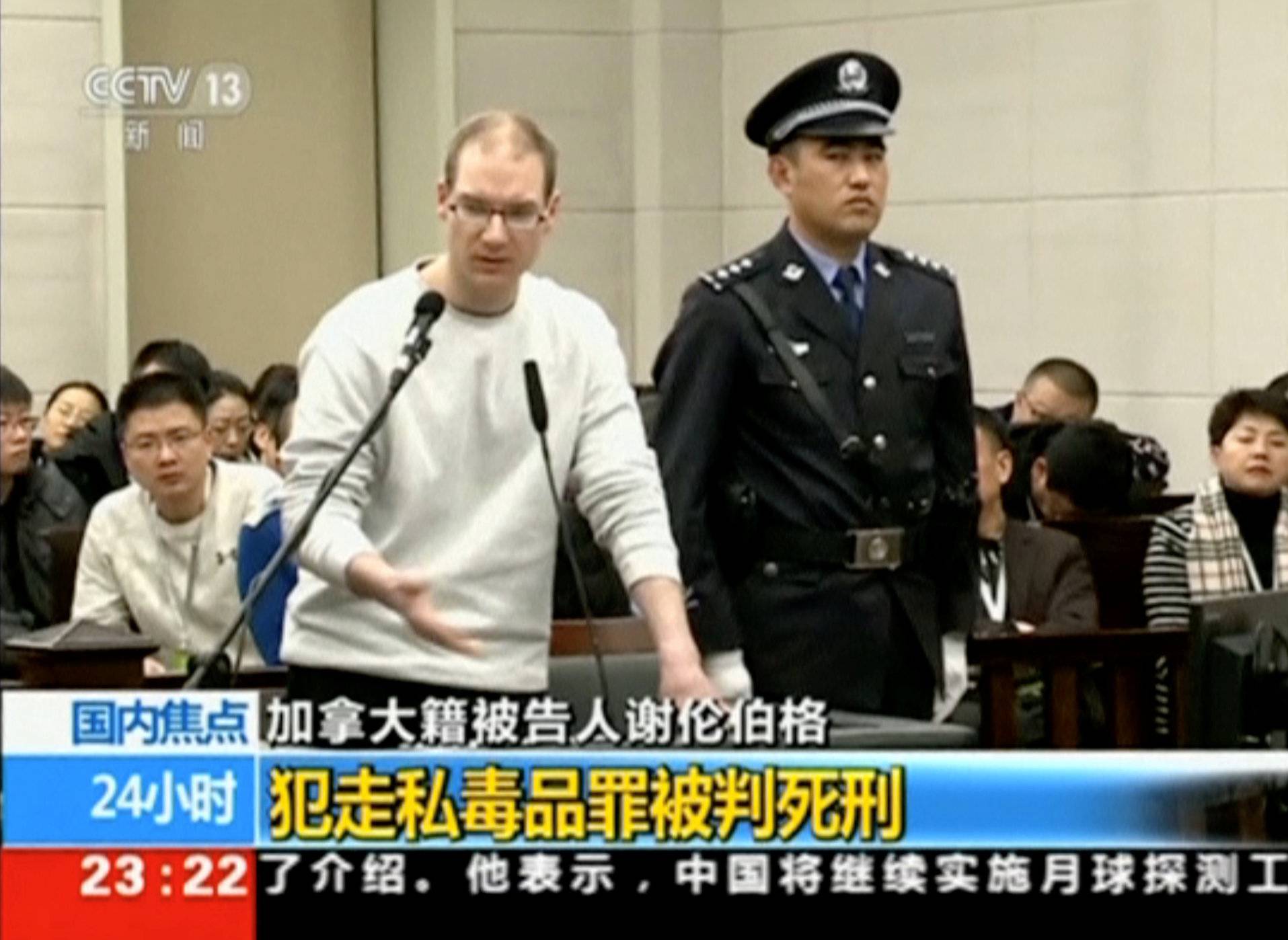 A still image taken from CCTV video shows Canadian Robert Lloyd Schellenberg in court, where he was sentenced with a death penalty for drug smuggling, in Dalian
