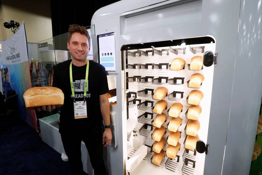 Eric Wilkinson stands by the Wilkinson Baking Company Breadbot, a self-contained, automated bakery, at "CES Unveiled" during the 2019 CES in Las Vegas