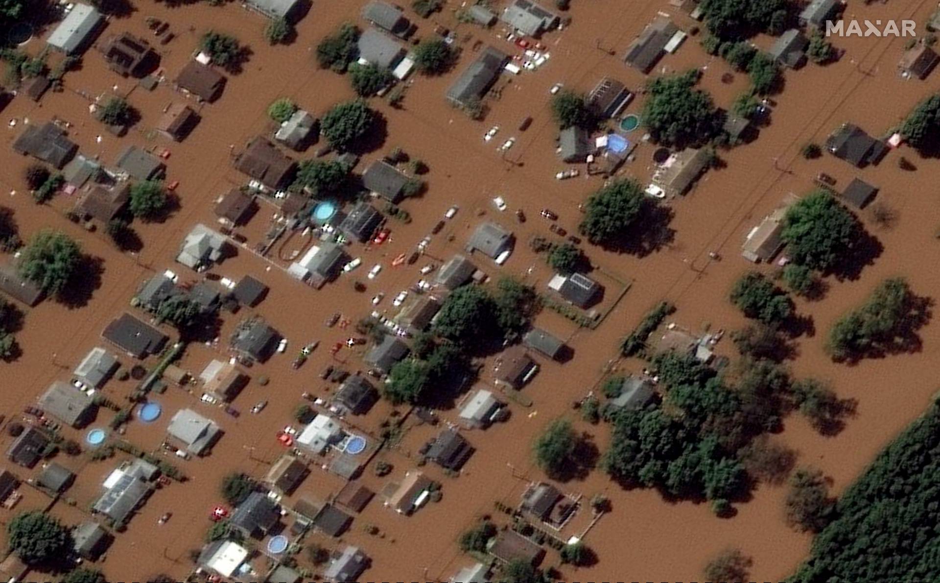 A satellite image shows houses submerged in floods caused by torrential rains unleashed by the remnants of Hurricane Ida, in Manville, New Jersey
