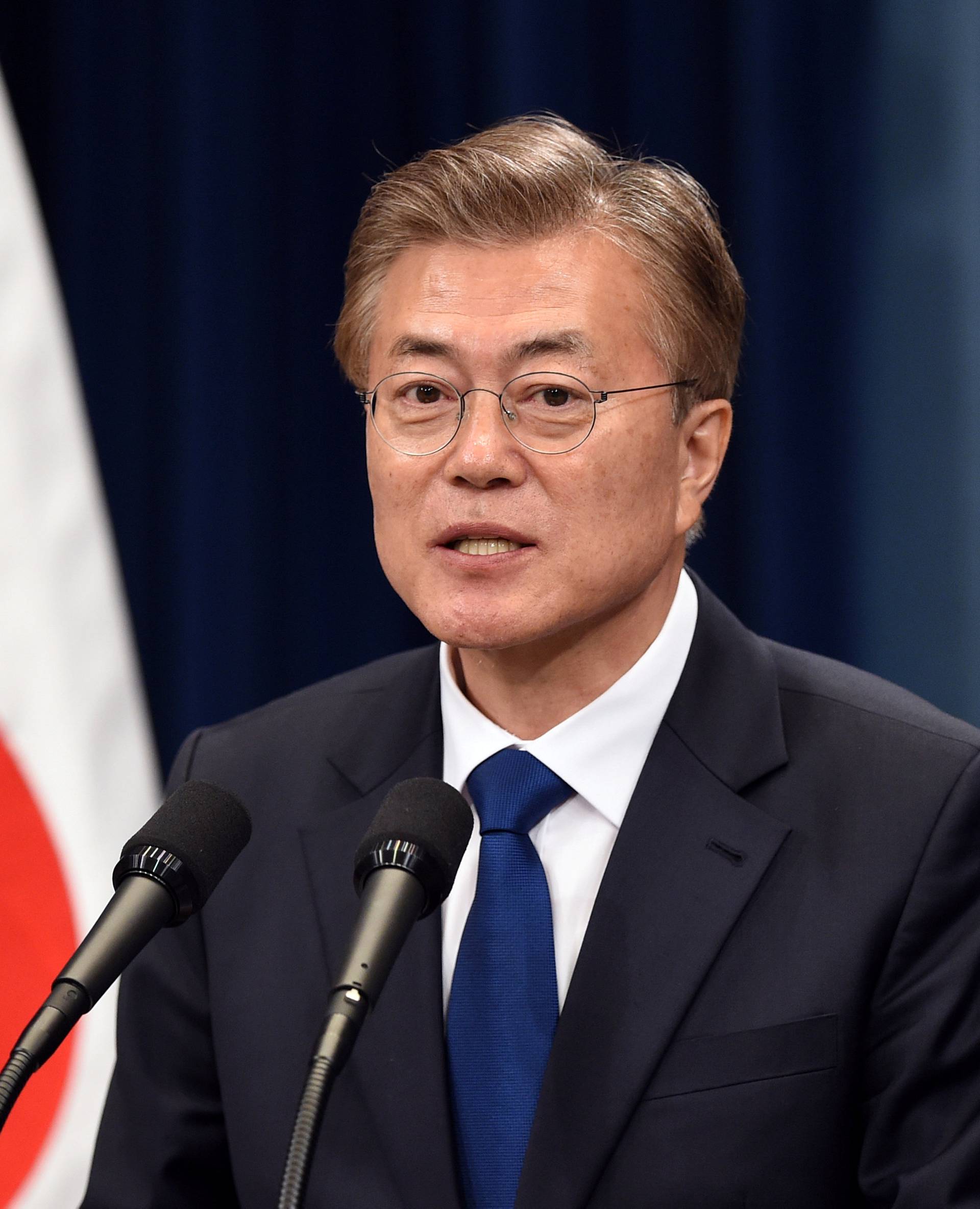 South Korea's new President Moon Jae-In speaks during a press conference at the presidential Blue House in Seoul