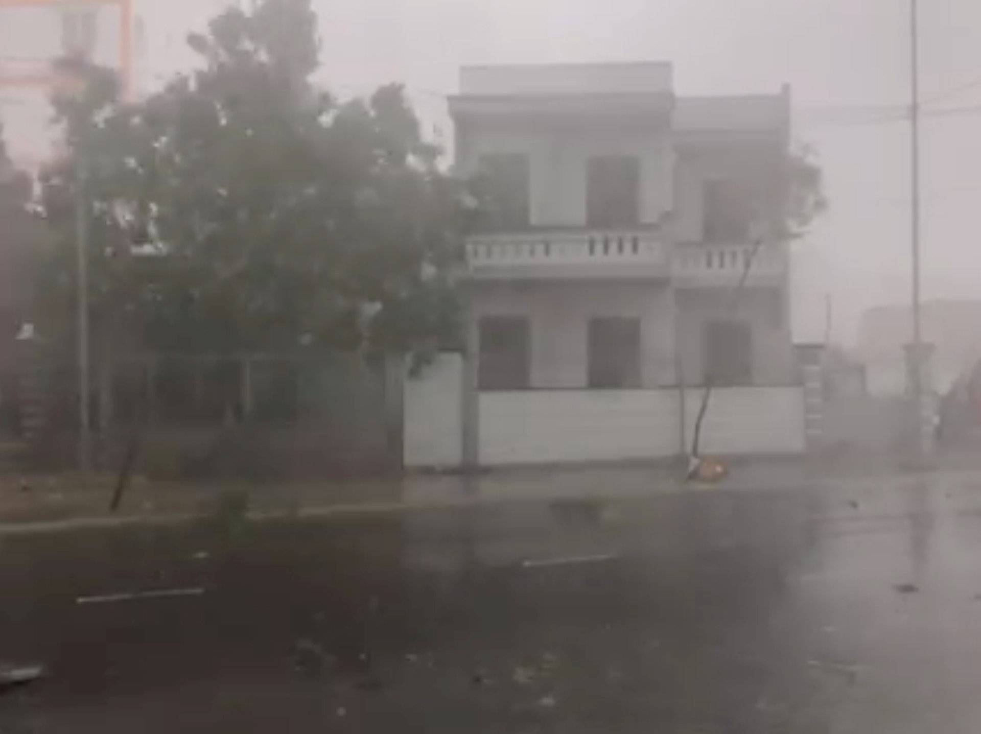 A storm batters a street in Nha Trang, as Typhoon Damrey descends on southern Vietnam