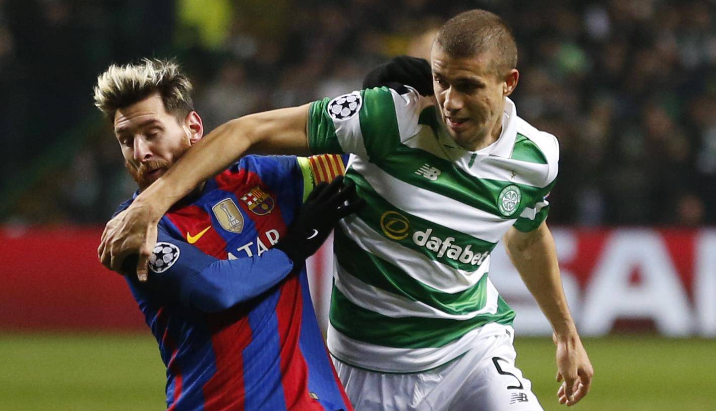 Celtic's Jozo Simunovic in action with Barcelona's Lionel Messi