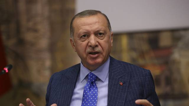 Turkish President Tayyip Erdogan talks to journalists in Istanbul