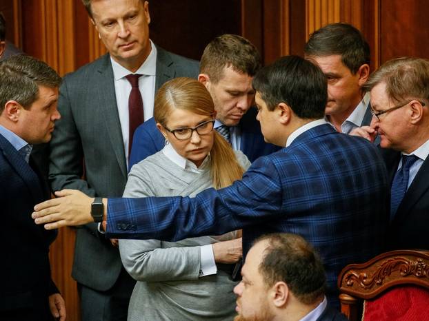 FILE PHOTO: Batkivshchyna party leader Tymoshenko listens to Razumkov, Ukraine's Parliamentary Speaker, during a parliament session in Kiev