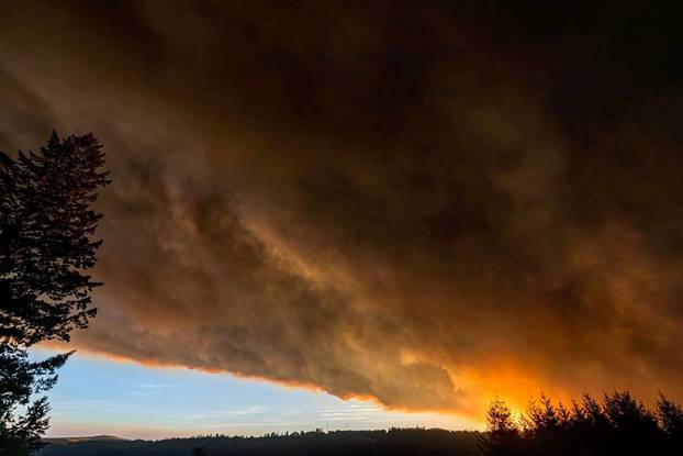 Thick smoke is seen above Salem City