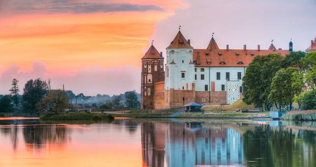 Mir, Belarus. Panorama Of Castle Complex Mir On Sunny Sunset Sky