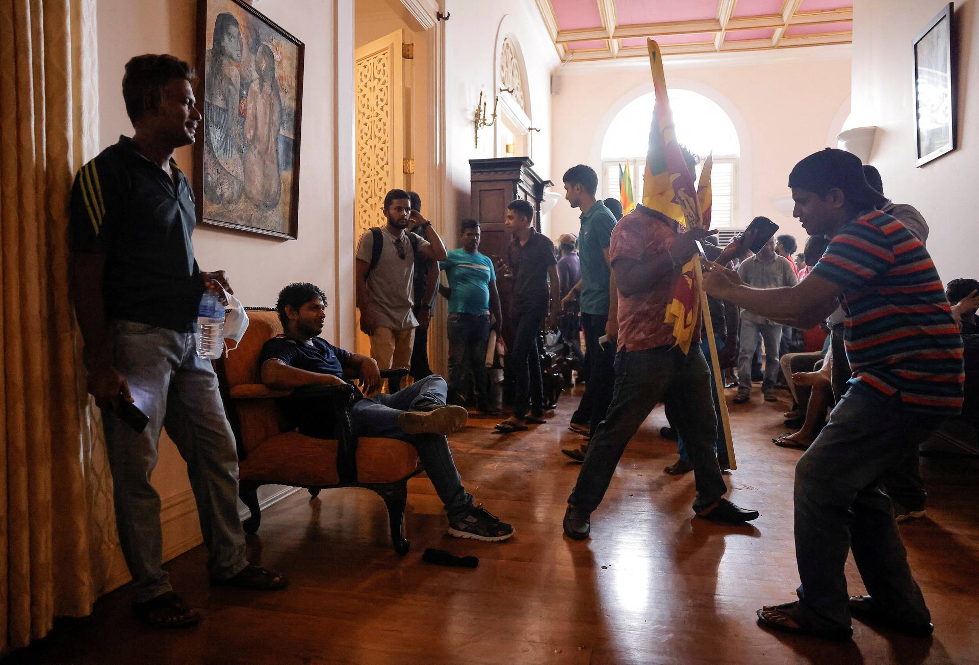 Demonstrators protest inside the President's House, after President Gotabaya Rajapaksa fled, in Colombo