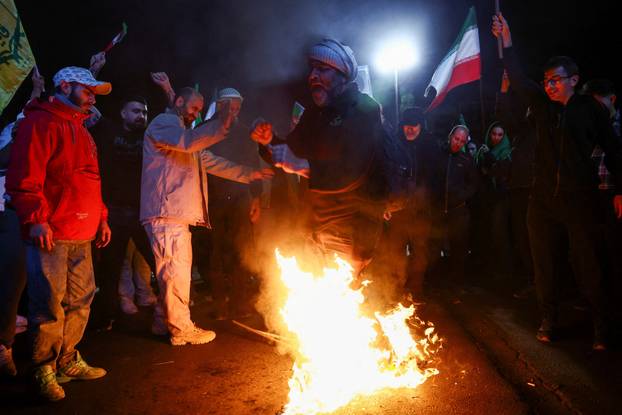 People gather after a two-week ceasefire in the Iran war was announced, in Tehran