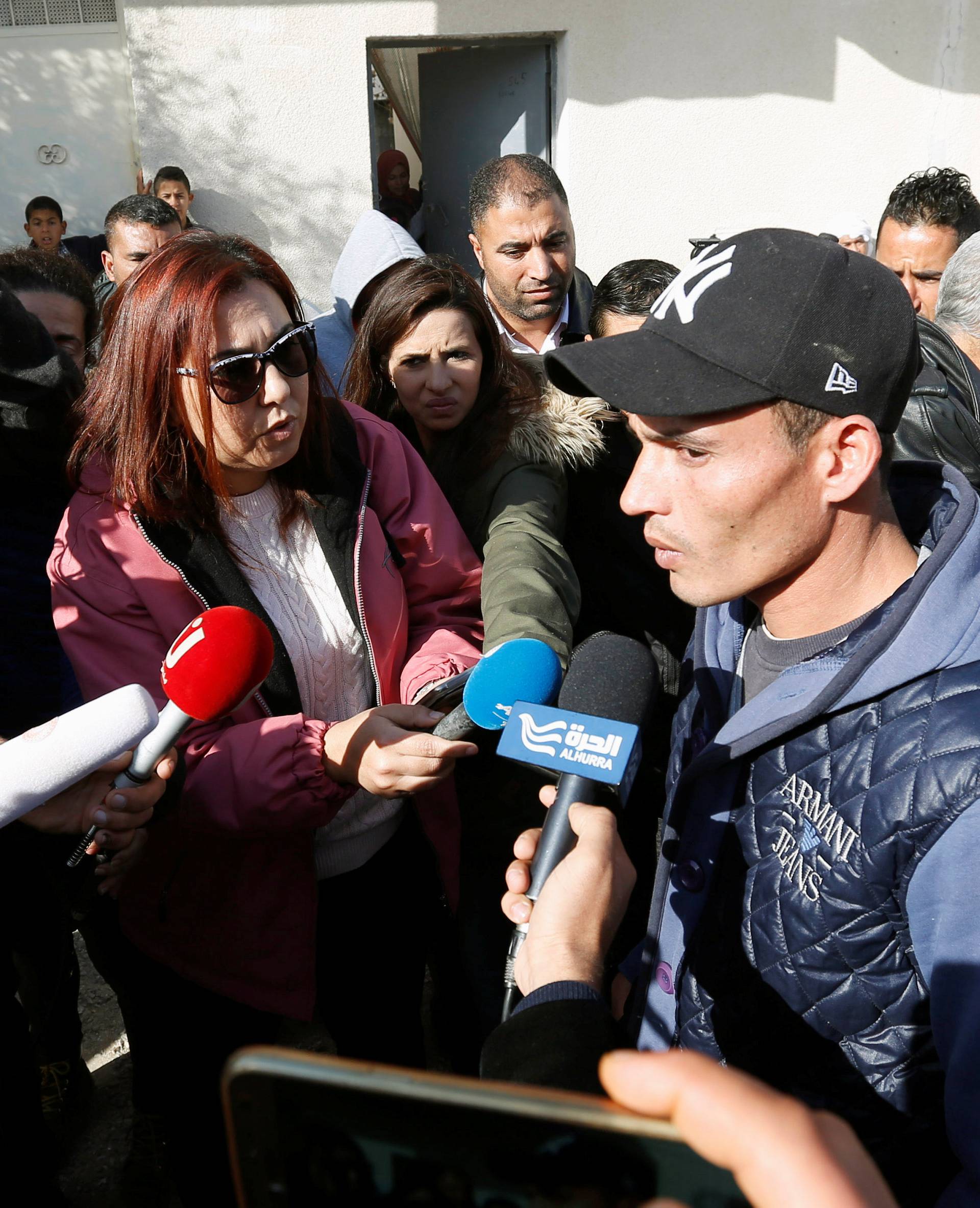 Walid, brother of suspect Anis Amri who is sought in relation with the truck attack on a Christmas market in Berlin, speaks to members of the media near their home in Oueslatia, Tunisia