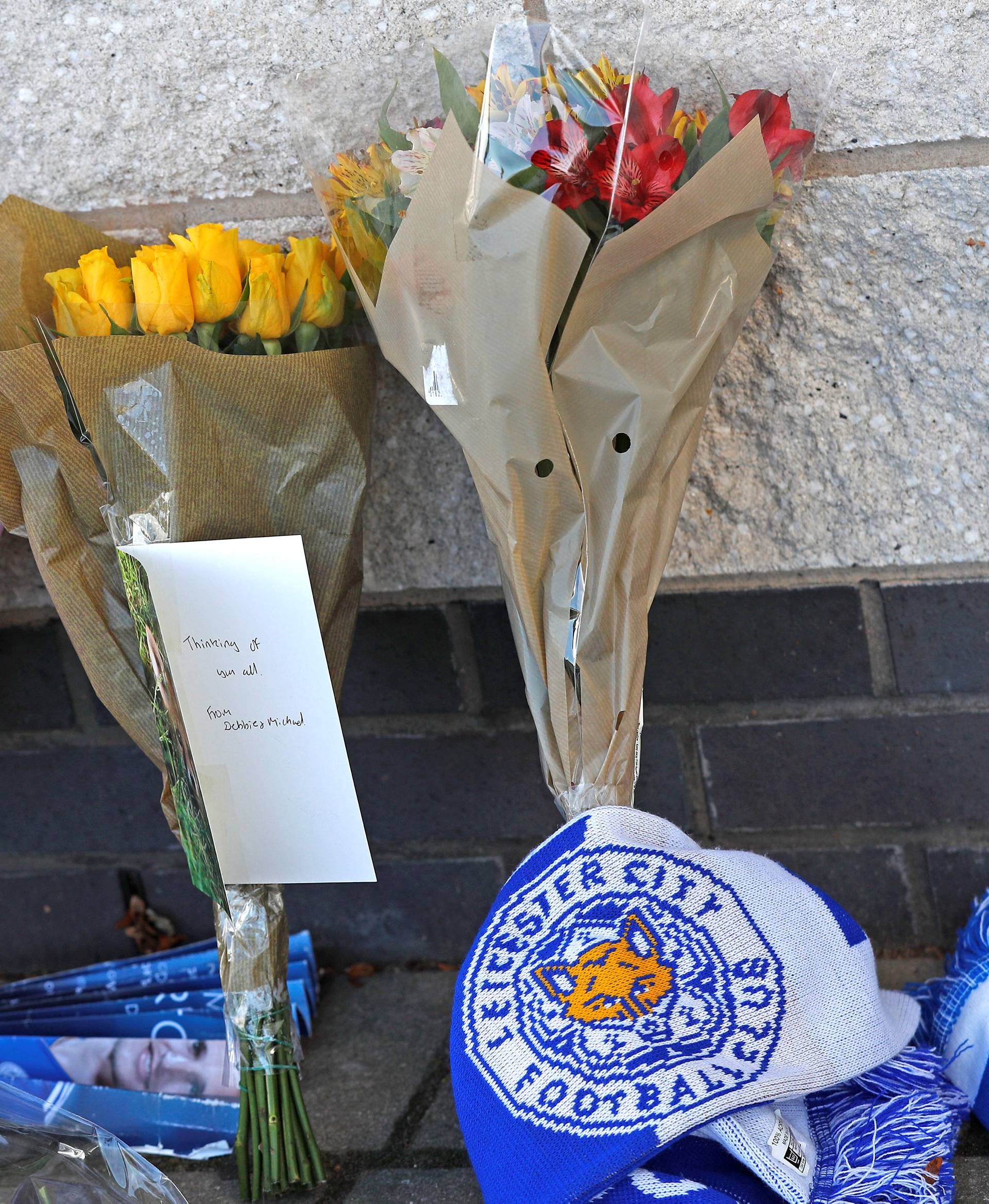 Messages and flowers can be seen placed outside Leicester City football stadium after the helicopter of the club owner Thai businessman Vichai Srivaddhanaprabha crashed when leaving the ground on Saturday evening after the match, in Leicester
