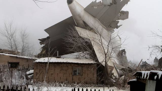 Plane debris is seen at the crash site of a Turkish cargo jet near Kyrgyzstan's Manas airport outside Bishkek