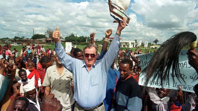 FILE PHOTO: Secretary General of the "Safina" party (Ark Party) Richard Leakey holds up mini ark as he waves to ..