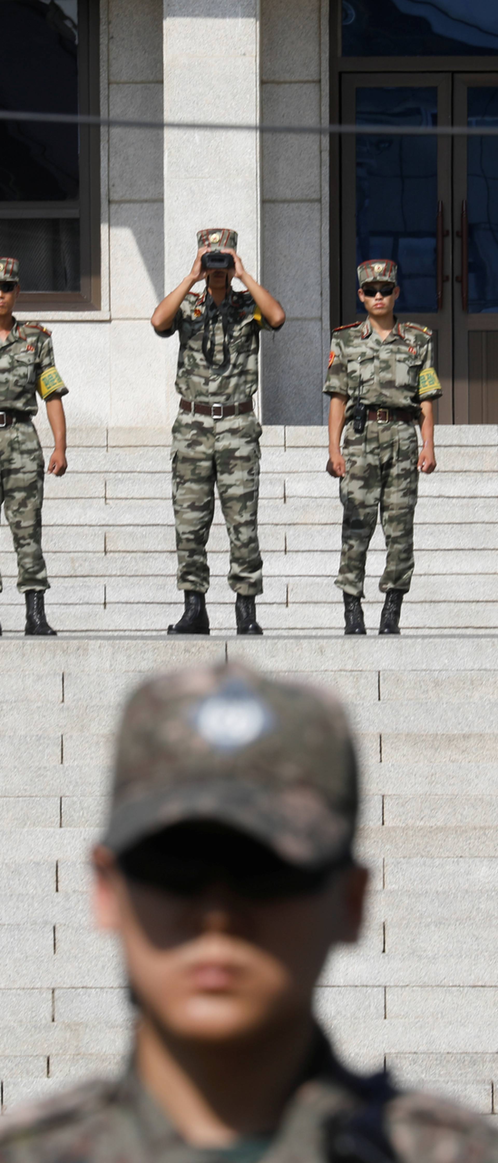 North Korean soldiers patrol in the truce village of Panmunjom