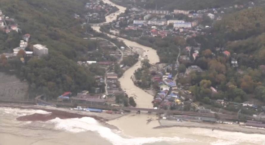 A still image shows a settlement affected by floodwaters in Krasnodar Region