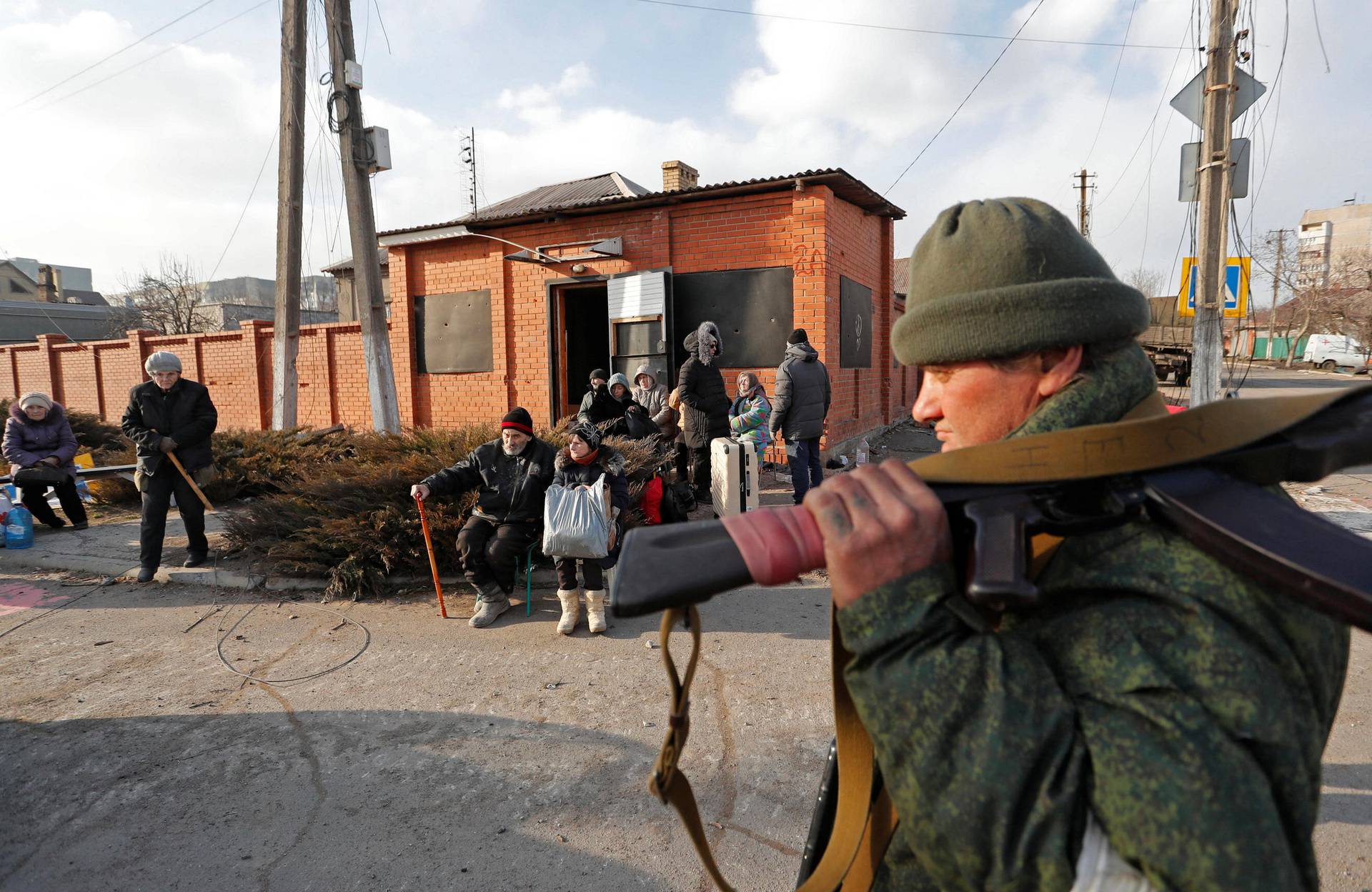 Evacuees leave the besieged city of Mariupol