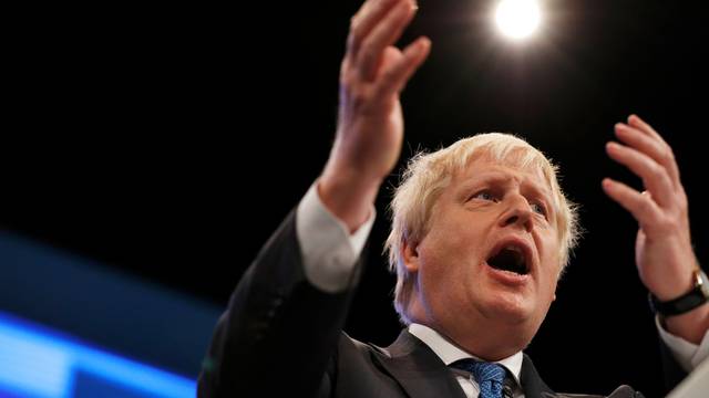 Britain's Foreign Secretary Boris Johnson addresses the Conservative Party conference in Manchester