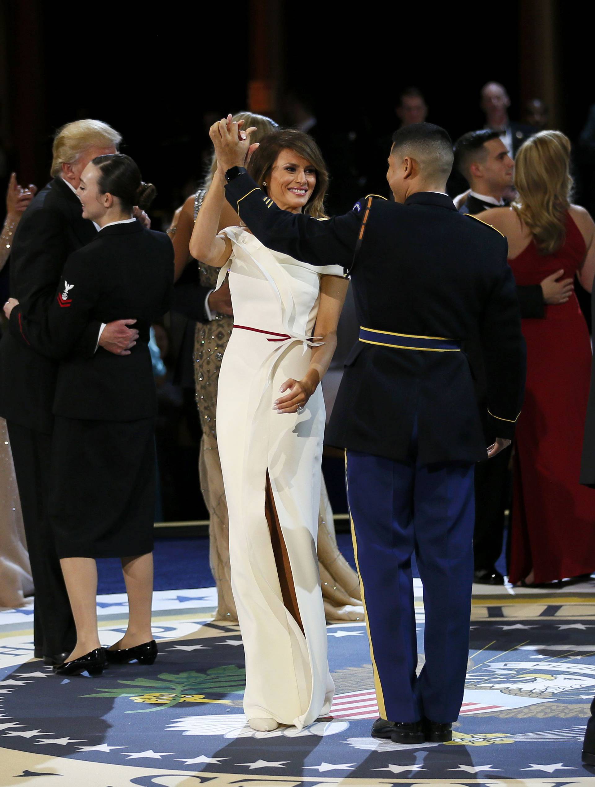 United States Army Staff Sergeant Jose A. Medina dances with U.S. first lady Melania Trump during the "Salute to Our Armed Services Ball" on Inauguration Day in Washington