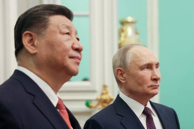 FILE PHOTO: Russian President Putin and Chinese President Xi meet in Moscow