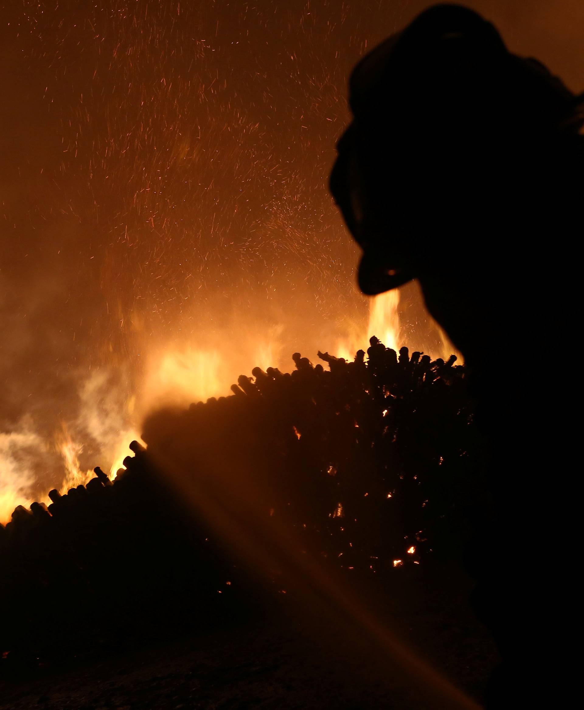 A firefighter tries to stop the fire in Santa Olga