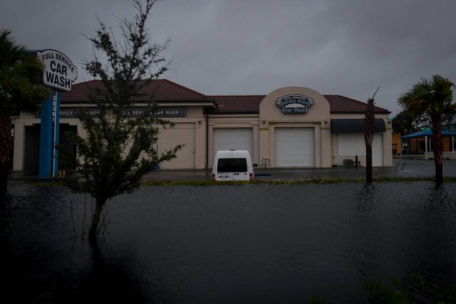 Floodwater from Hurricane Irma surrounds a car wash in Bonita Springs