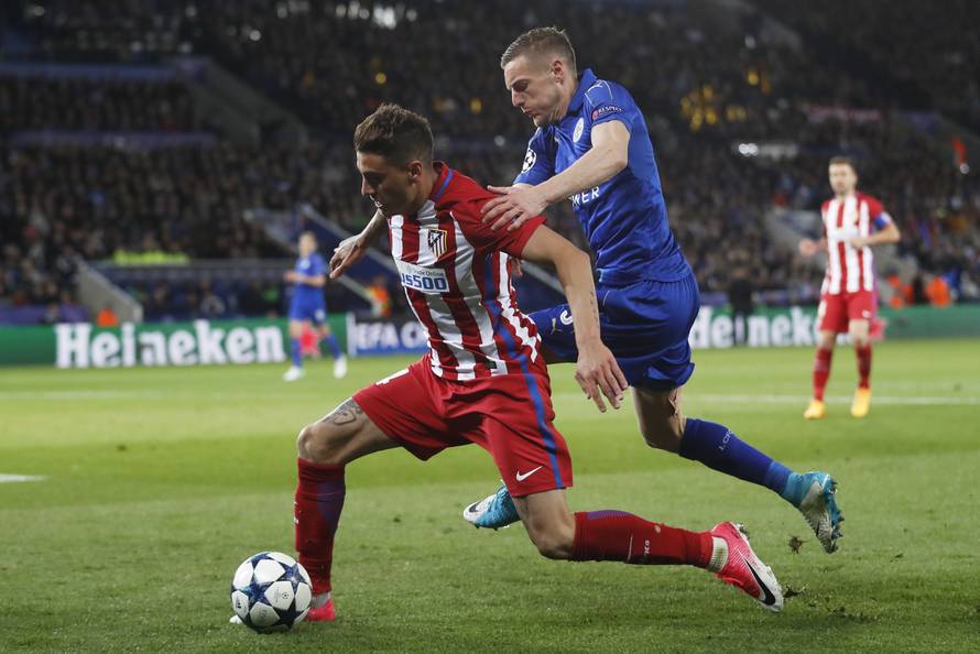 Atletico Madrid's Jose Gimenez in action with Leicester City's Jamie Vardy
